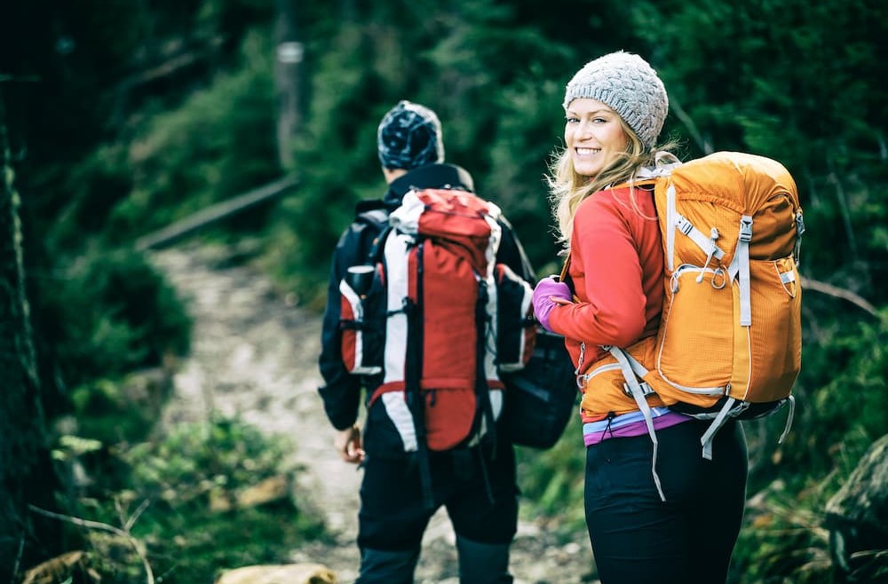 couple backpackers heading out on their first backpacking camping trip